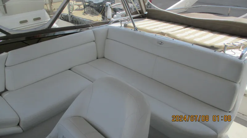 Slide: The Image of 2007 Regal 4080 Sportyacht interior with white leather seating. - 14
