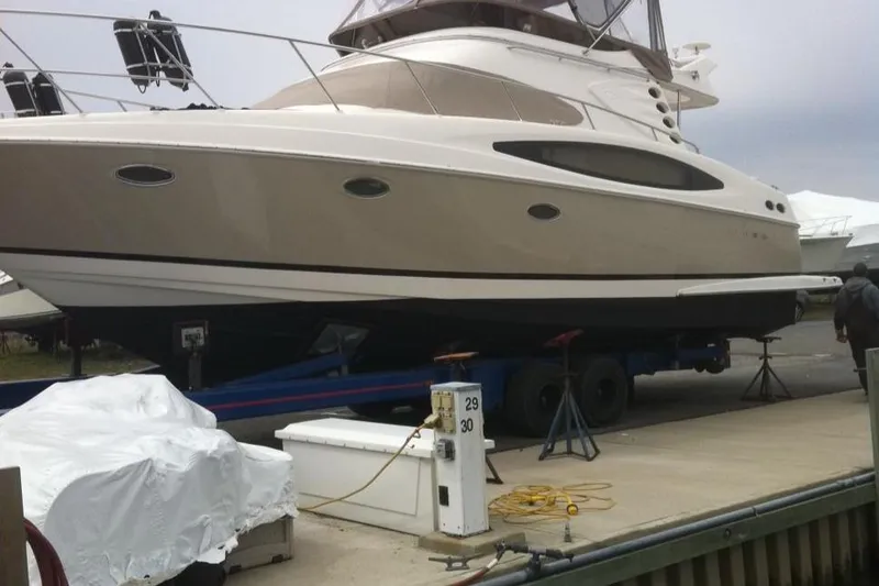 Slide: The Image of 2007 Regal 4080 Sportyacht on trailer at marina dock. - 2