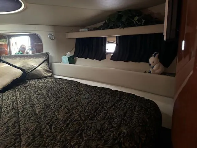 Slide: The Image of Luxurious cabin interior of a 2007 Regal 4080 Sportyacht with bed and decor. - 38