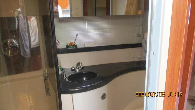Slide: The Image of Bathroom interior of 2007 Regal 4080 Sportyacht with sink and mirror. - 28