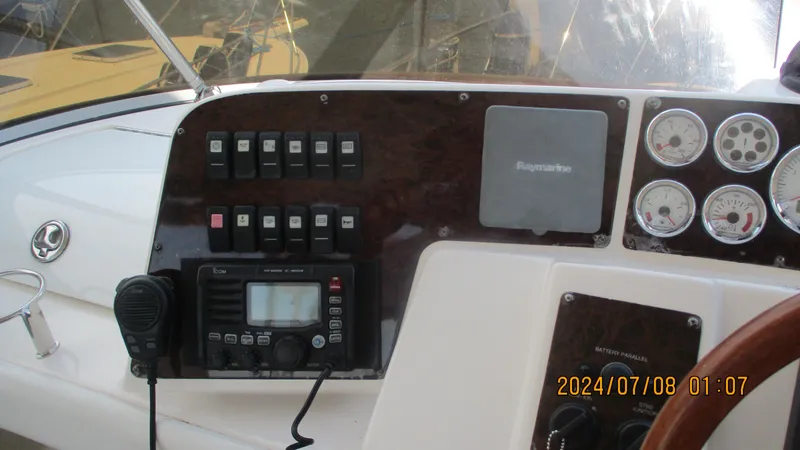 Slide: The Image of Control panel of a 2007 Regal 4080 Sportyacht with navigation and communication equipment. - 9