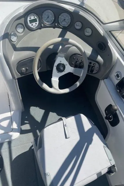 Slide: The Image of 2001 Moomba Mobius SK boat dashboard and steering wheel. - 1