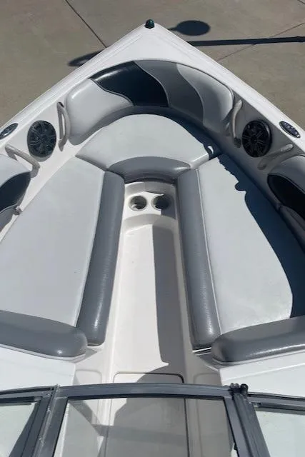 Slide: The Image of 2001 Moomba Mobius SK boat interior with gray seating and built-in speakers. - 5