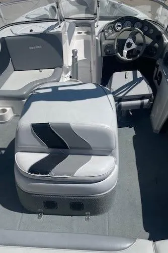 Slide: The Image of 2001 Moomba Mobius SK boat interior with gray and white seating and dashboard. - 6