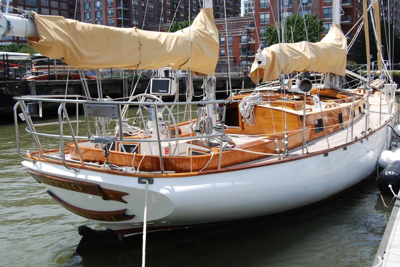 The Image of 1983 Cherubini 44 Ketch sailboat docked in a marina. - 0