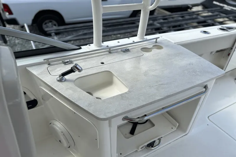 Slide: The Image of Boston Whaler 270 Vantage 2017 boat sink and counter area with storage. - 10