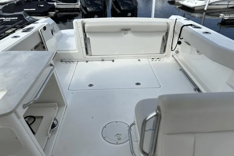 Slide: The Image of 2017 Boston Whaler 270 Vantage boat interior, featuring spacious seating and storage areas. - 11