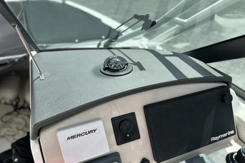 Slide: The Image of Dashboard of a 2017 Boston Whaler 270 Vantage with compass and Raymarine equipment. - 15