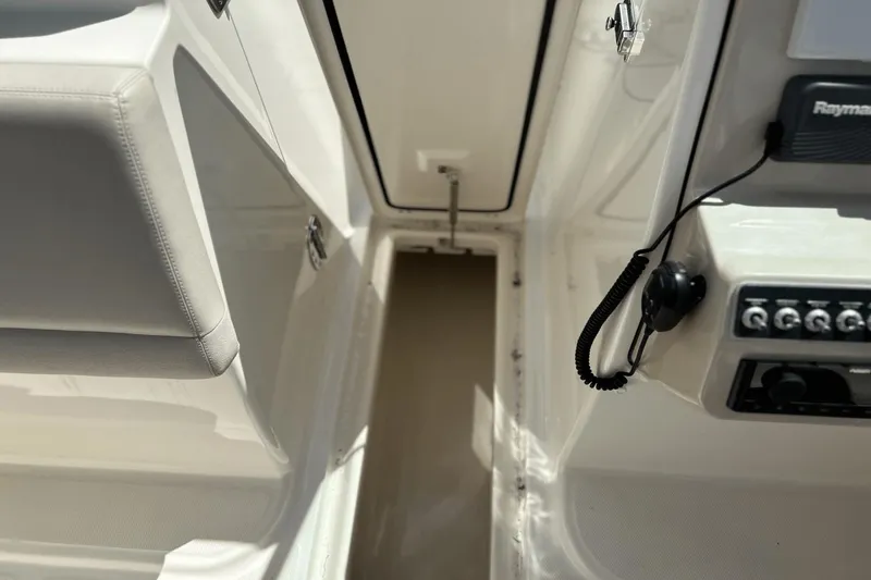 Slide: The Image of Interior view of a 2017 Boston Whaler 270 Vantage boat cockpit with control panel. - 17