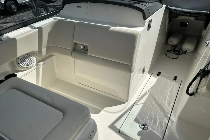 Slide: The Image of 2017 Boston Whaler 270 Vantage interior, featuring seating and storage compartments. - 18