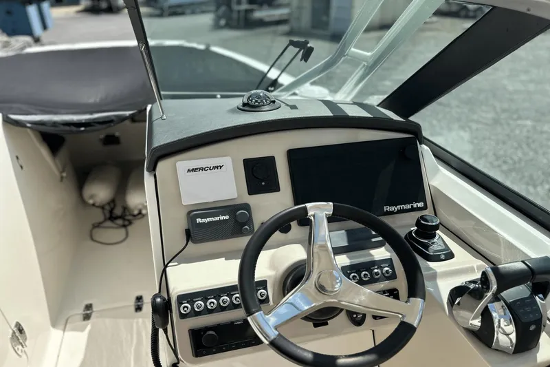 Slide: The Image of 2017 Boston Whaler 270 Vantage helm with Raymarine electronics and Mercury controls. - 24