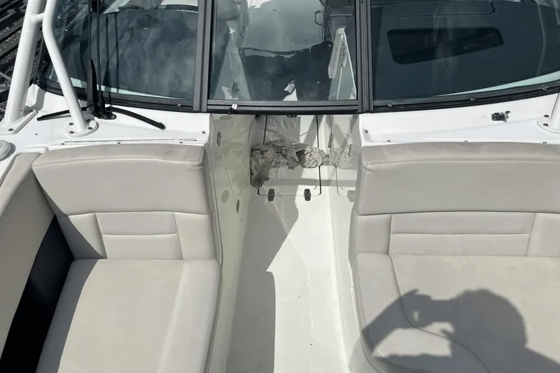 Slide: The Image of 2017 Boston Whaler 270 Vantage boat interior with seating and windshield. - 27