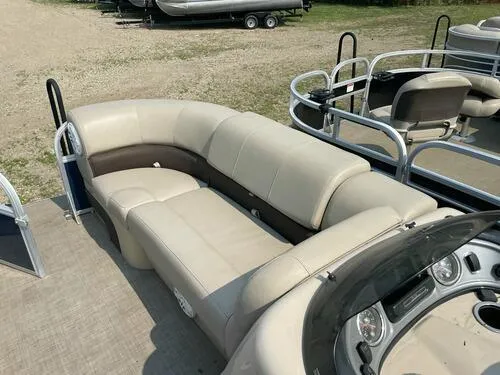 Slide: The Image of 2019 Sun Tracker Party Barge 22 XP3 pontoon boat with beige seating and control panel. - 11