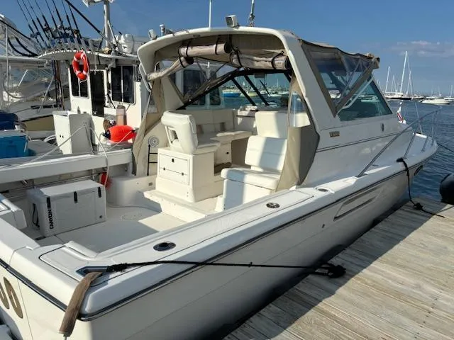 Slide: The Image of 2001 Tiara Yachts 2900 Open docked at marina, rear view. - 11