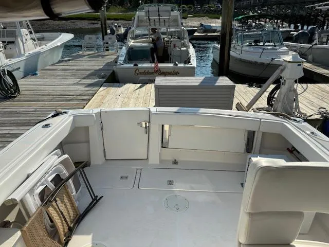 Slide: The Image of 2001 Tiara Yachts 2900 Open interior with white seating and helm station. - 15