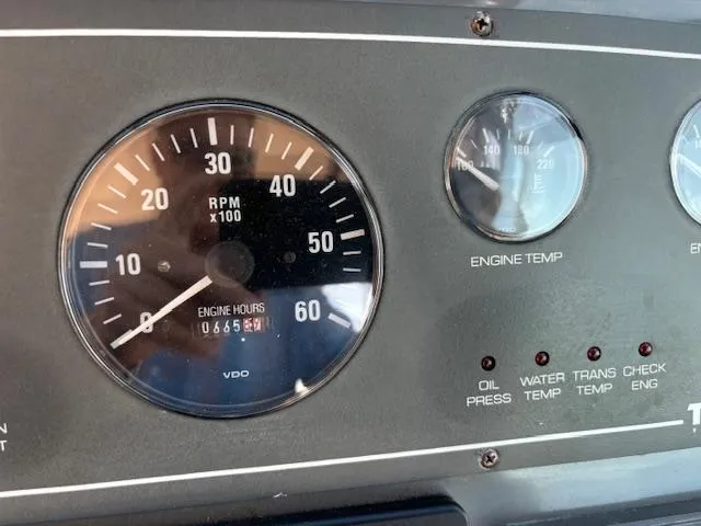 Slide: The Image of 2001 Tiara Yachts 2900 Open dashboard with gauges, controls, and navigation equipment. - 16