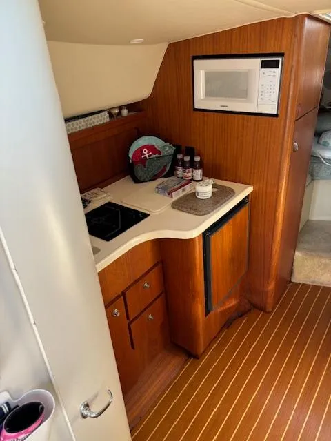 Slide: The Image of 2001 Tiara Yachts 2900 Open battery compartment with multiple red batteries. - 20