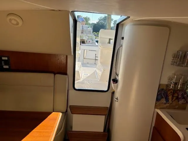 Slide: The Image of 2001 Tiara Yachts 2900 Open cabin interior with bed and storage. - 25