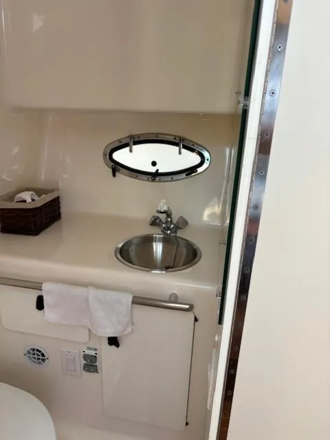 Slide: The Image of 2001 Tiara Yachts 2900 Open cabin interior with bed and storage space. - 26