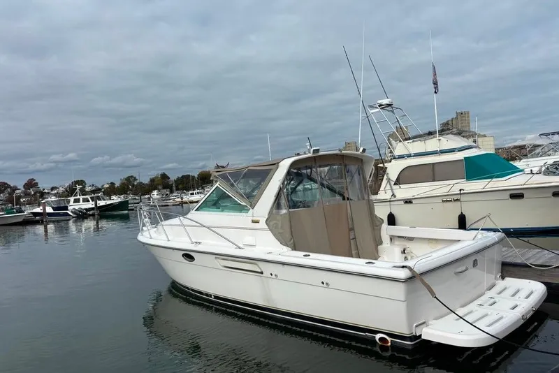 Slide: The Image of 2001 Tiara Yachts 2900 Open docked in a marina, overcast sky. - 30
