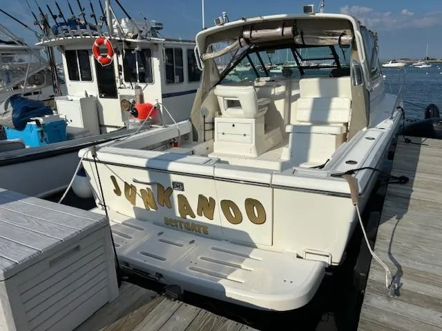 Slide: The Image of 2001 Tiara Yachts 2900 Open on calm waters with other boats in the background. - 8