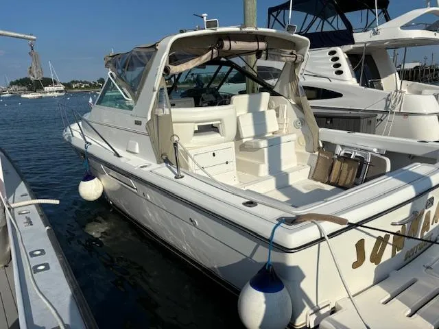 Slide: The Image of 2001 Tiara Yachts 2900 Open docked at a marina, rear view. - 9