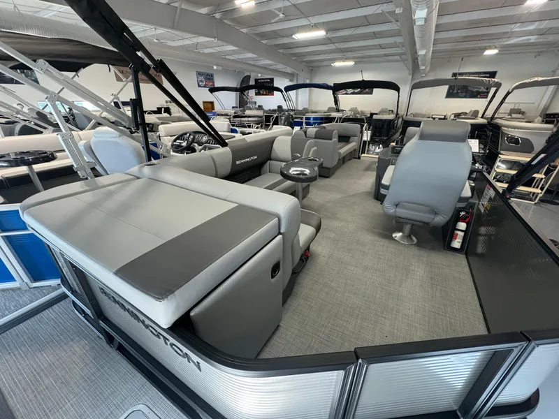 Slide: The Image of 2024 Bennington 20SL pontoon boat interior with gray seating and modern design. - 5