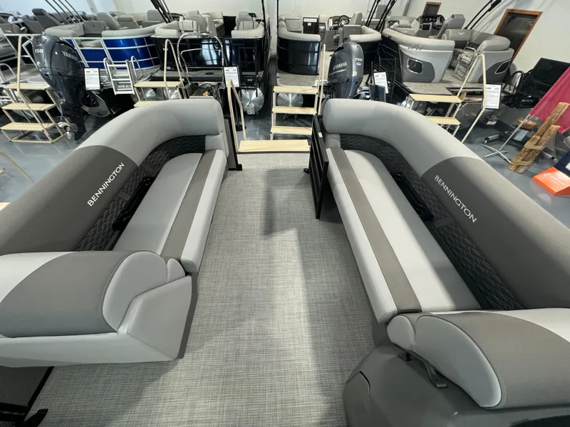 Slide: The Image of 2024 Bennington 20SL pontoon boat interior with gray seating and spacious layout. - 6