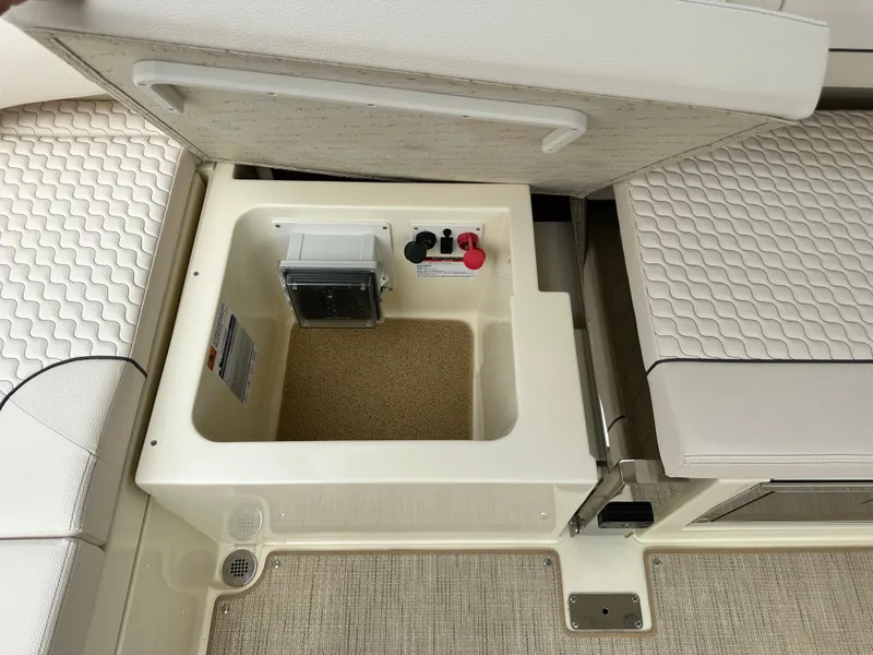 Slide: The Image of 2025 Chris-Craft Launch 31 GT storage compartment with electrical components. - 15