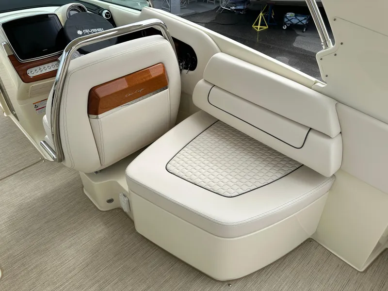 Slide: The Image of 2025 Chris-Craft Launch 31 GT interior seating with luxurious white upholstery. - 17