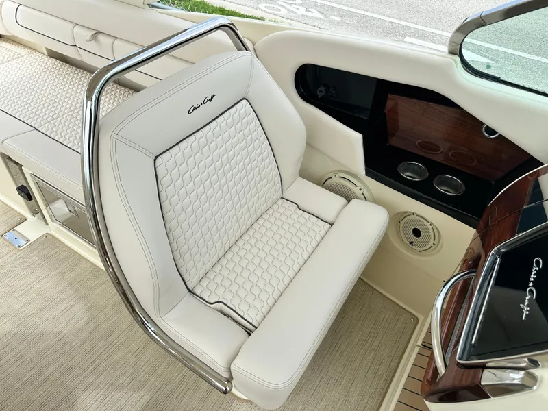 Slide: The Image of 2025 Chris-Craft Launch 31 GT boat interior with luxurious white seating. - 24