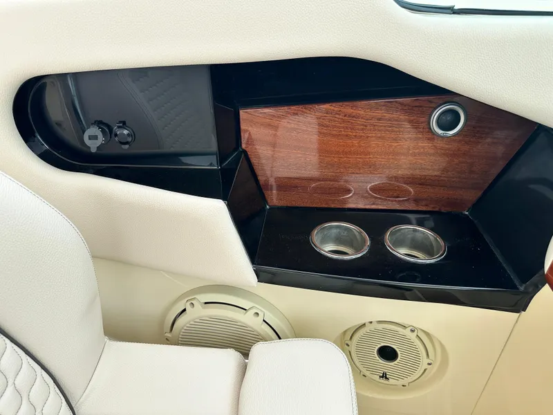 Slide: The Image of Interior detail of 2025 Chris-Craft Launch 31 GT boat with cup holders and wood finish. - 25