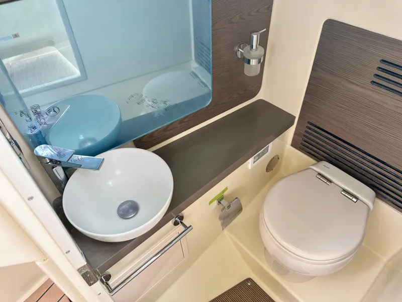 Slide: The Image of 2025 Chris-Craft Launch 31 GT boat bathroom with modern sink and toilet. - 32