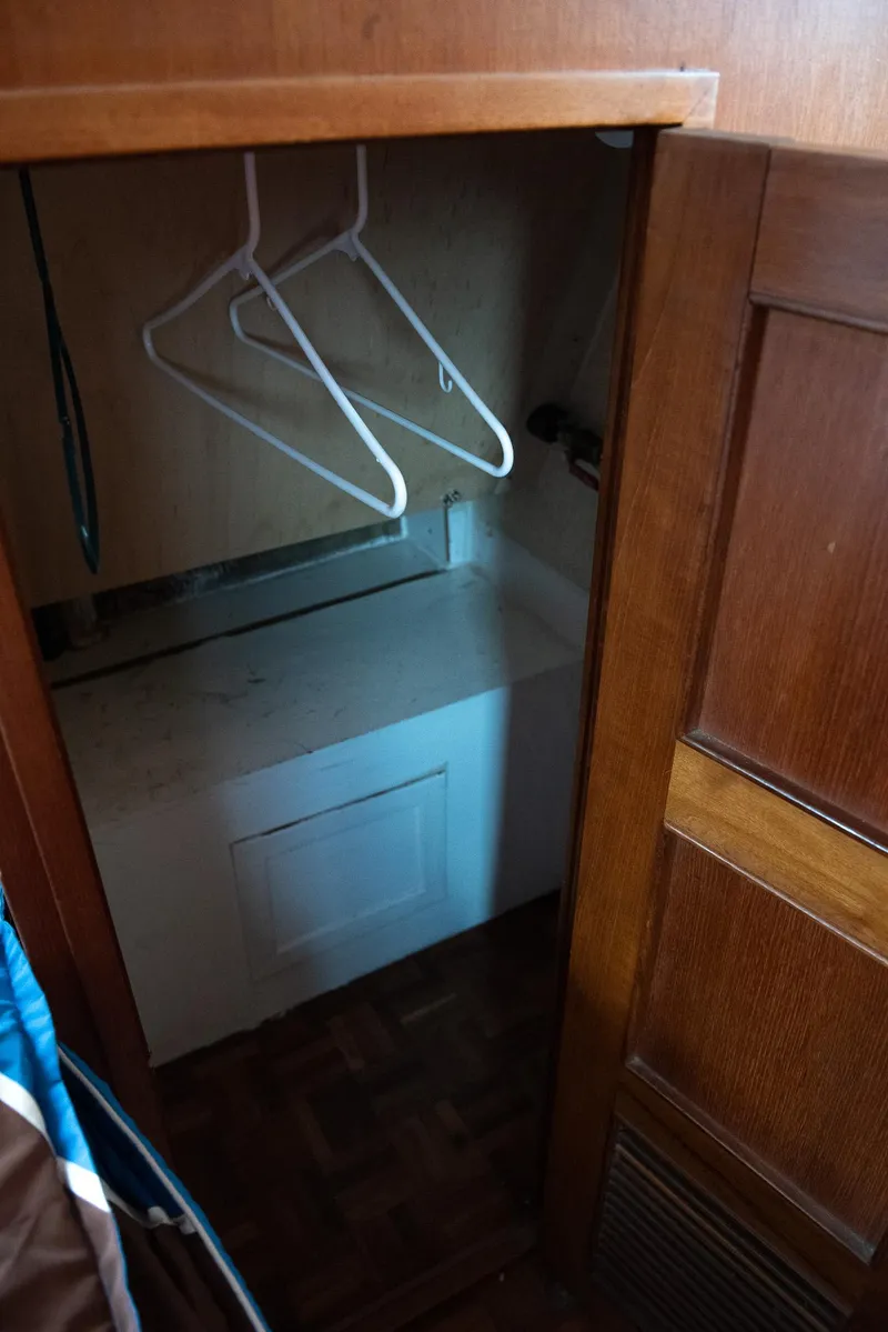 Slide: The Image of Small closet space with hangers in 1978 CHB Puget Trawler 37 boat. - 38