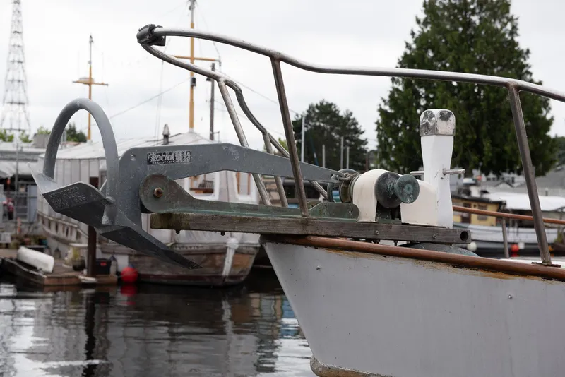Slide: The Image of 1978 CHB Puget Trawler 37 anchor and bow at marina. - 39