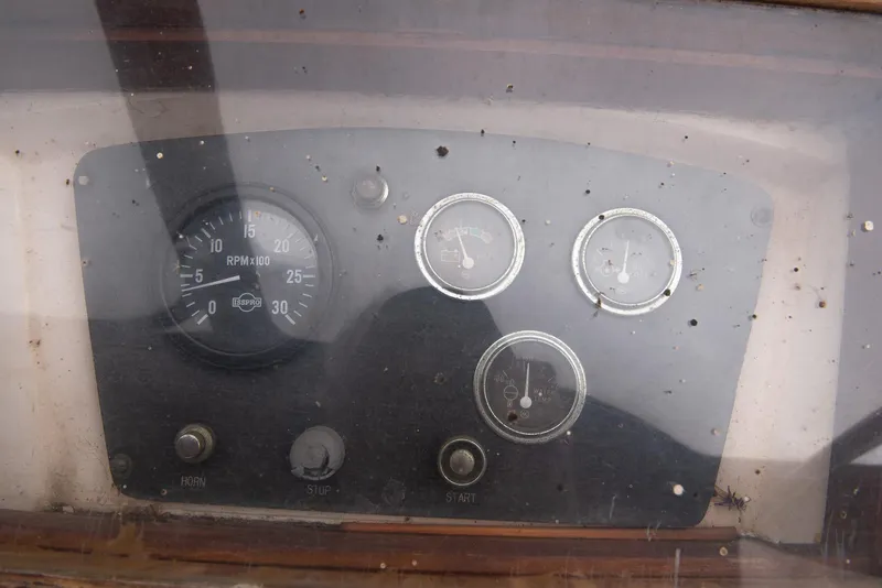 Slide: The Image of 1978 CHB Puget Trawler 37 dashboard with gauges and controls. - 48