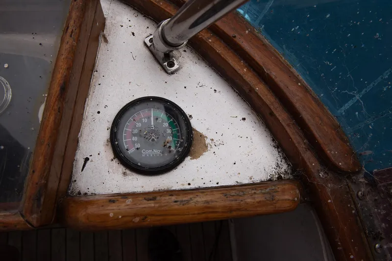Slide: The Image of Close-up of the 1978 CHB Puget Trawler 37's weathered compass. - 49