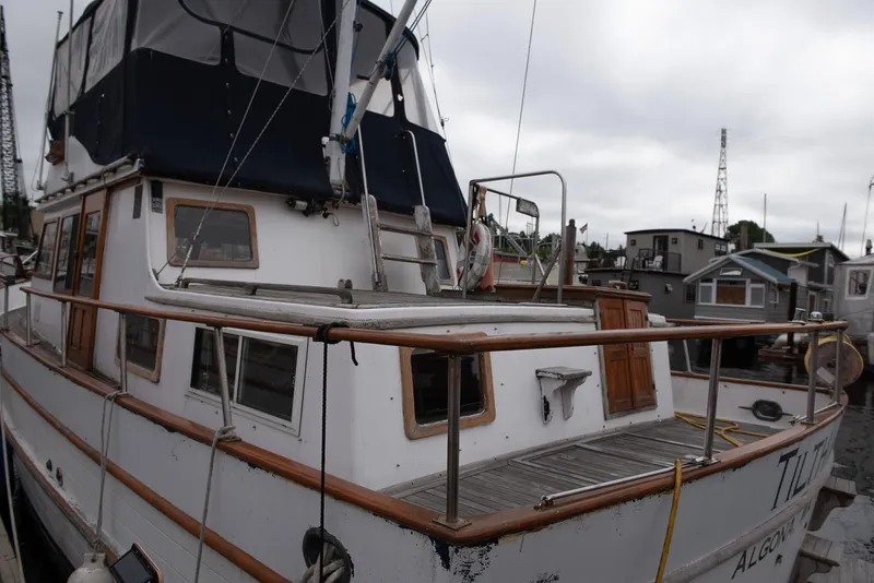 Slide: The Image of 1978 CHB Puget Trawler 37 docked at marina, rear view. - 55