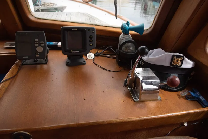 Slide: The Image of 1978 CHB Puget Trawler 37 helm with navigation equipment and controls. - 9