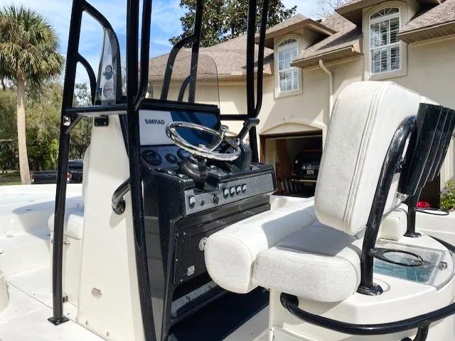 Slide: The Image of 2019 ShearWater 23LTZ boat interior with steering console and seating. - 7