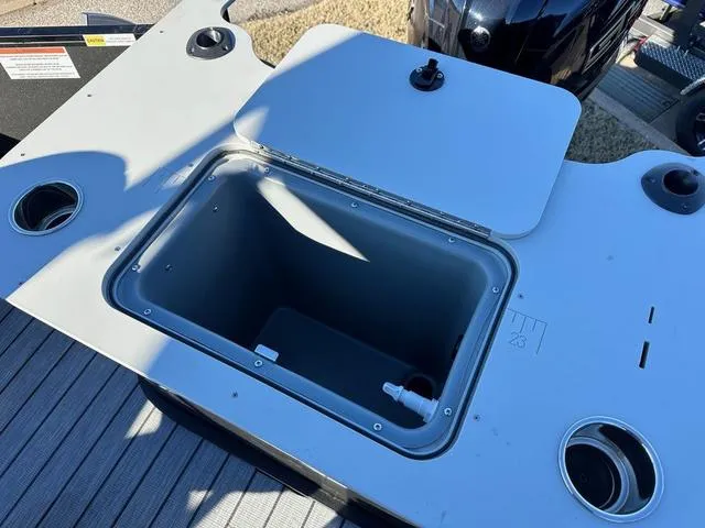 Slide: The Image of Open storage compartment on 2024 SunCatcher Fusion 322FC boat. - 5