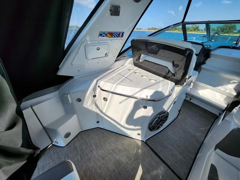 Slide: The Image of Interior of 2019 Monterey 335SY boat with seating and lake view. - 13