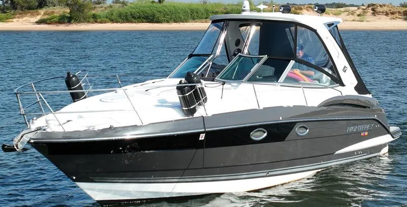 Slide: The Image of 2019 Monterey 335SY boat cruising on a sunny day. - 3