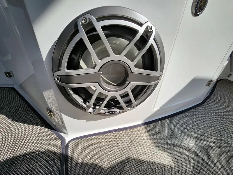 Slide: The Image of Close-up of a 2019 Monterey 335SY boat speaker on a carpeted deck. - 47