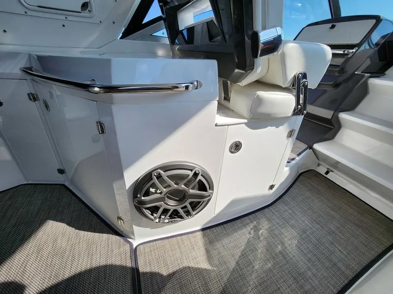 Slide: The Image of Interior of 2019 Monterey 335SY boat with speaker and seating area. - 49