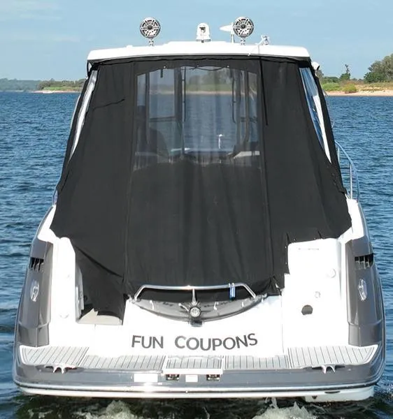 Slide: The Image of 2019 Monterey 335SY boat on water, rear view with "Fun Coupons" name. - 6