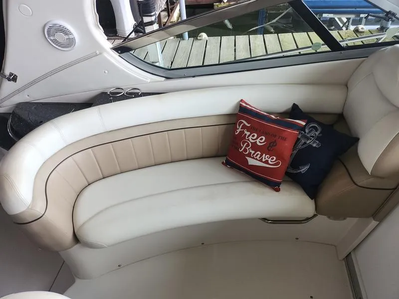 Slide: The Image of 2007 Four Winns 358 Vista boat interior with curved seating and decorative pillows. - 14