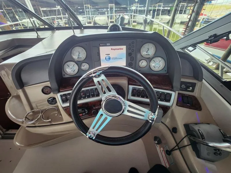 Slide: The Image of 2007 Four Winns 358 Vista boat helm with Raymarine navigation system and gauges. - 17