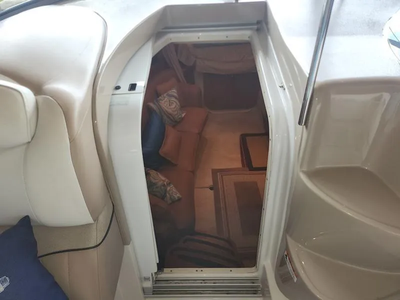 Slide: The Image of 2007 Four Winns 358 Vista cabin interior with seating and carpet. - 19