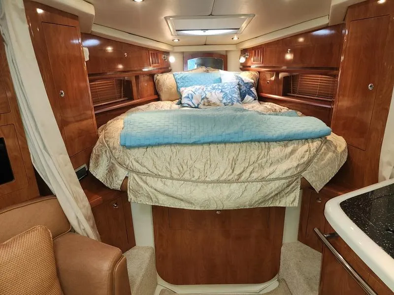 Slide: The Image of Luxurious cabin interior of 2007 Four Winns 358 Vista yacht with cozy bedding. - 21
